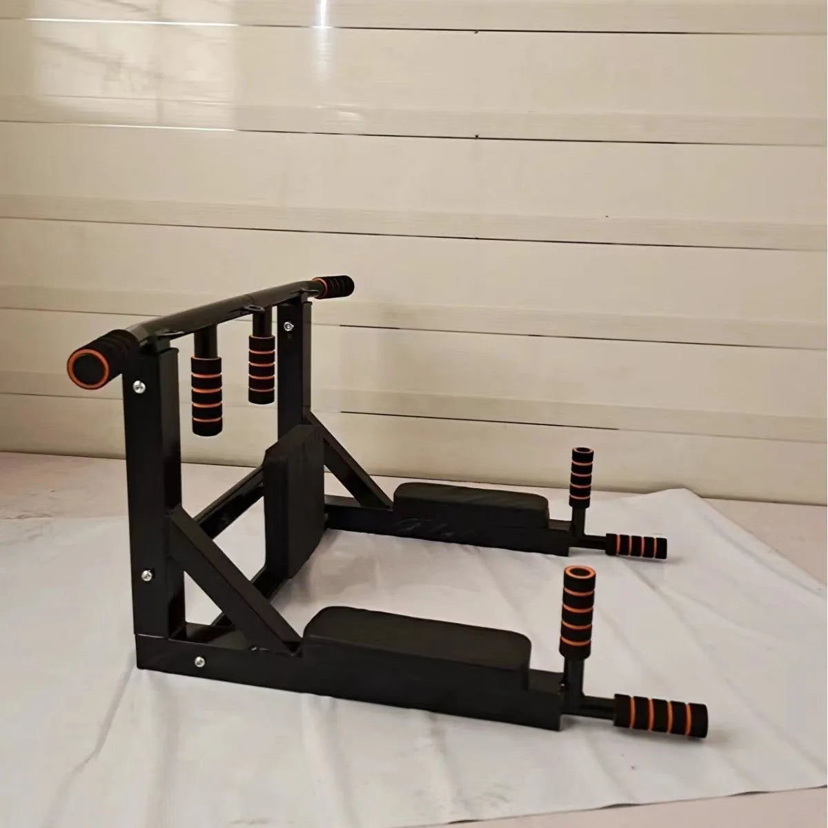 Black wall-mounted sandbag rack with parallel bars for pull-up exercises and martial arts training