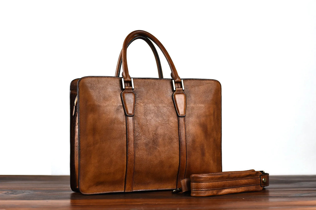 Men's brown leather horizontal square handbag with zipper opening showing 14 inch size