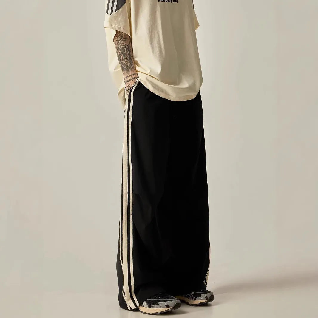 Black wide leg climbing trousers with high waist and straight leg design on hanger