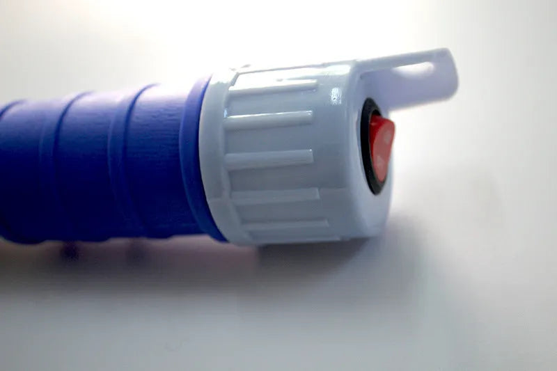 Manual hand-operated siphon pump with blue flexible tubing for transferring gasoline and oil.