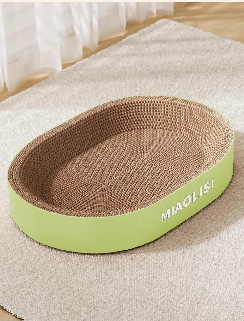 Oval-shaped green corrugated paper cat scratch board and nest measuring 55cm in diameter