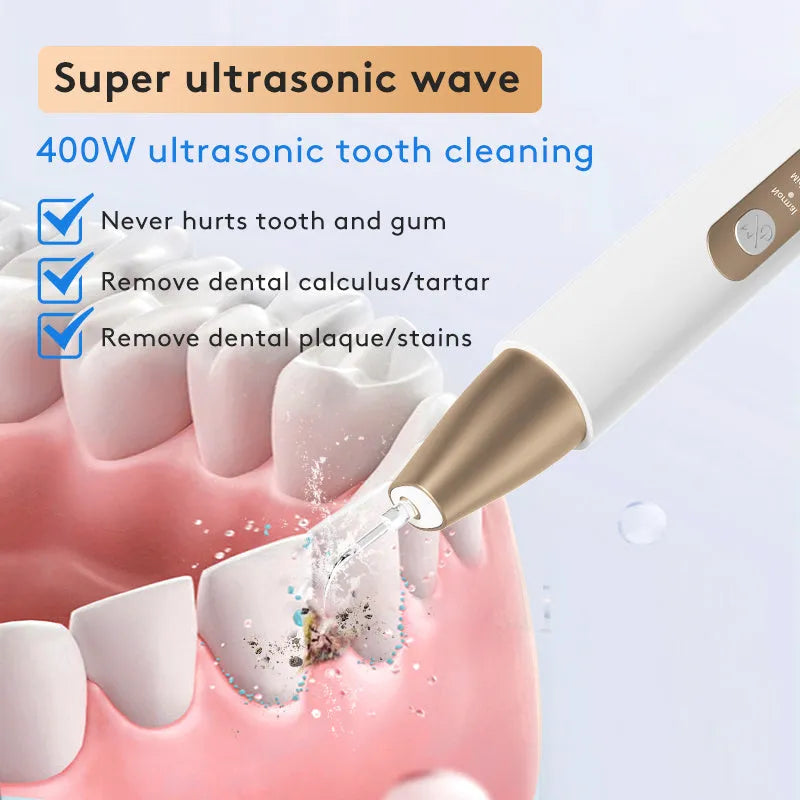 Gold ultrasonic tooth cleaning device for removing tartar and surface stains at home.