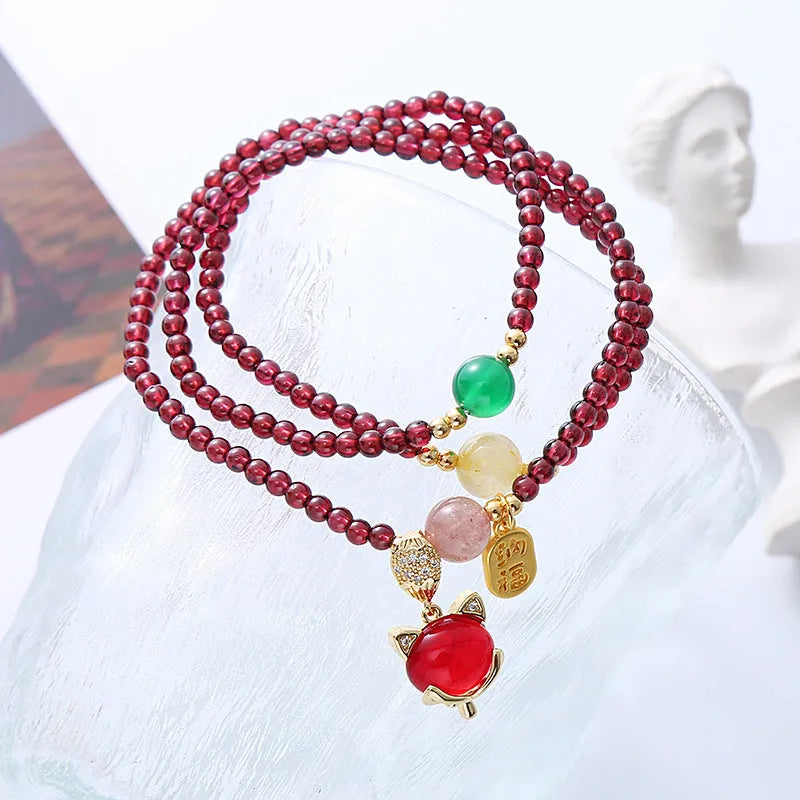 Purplish red garnet fox charm bracelet with adjustable cord fastening for women