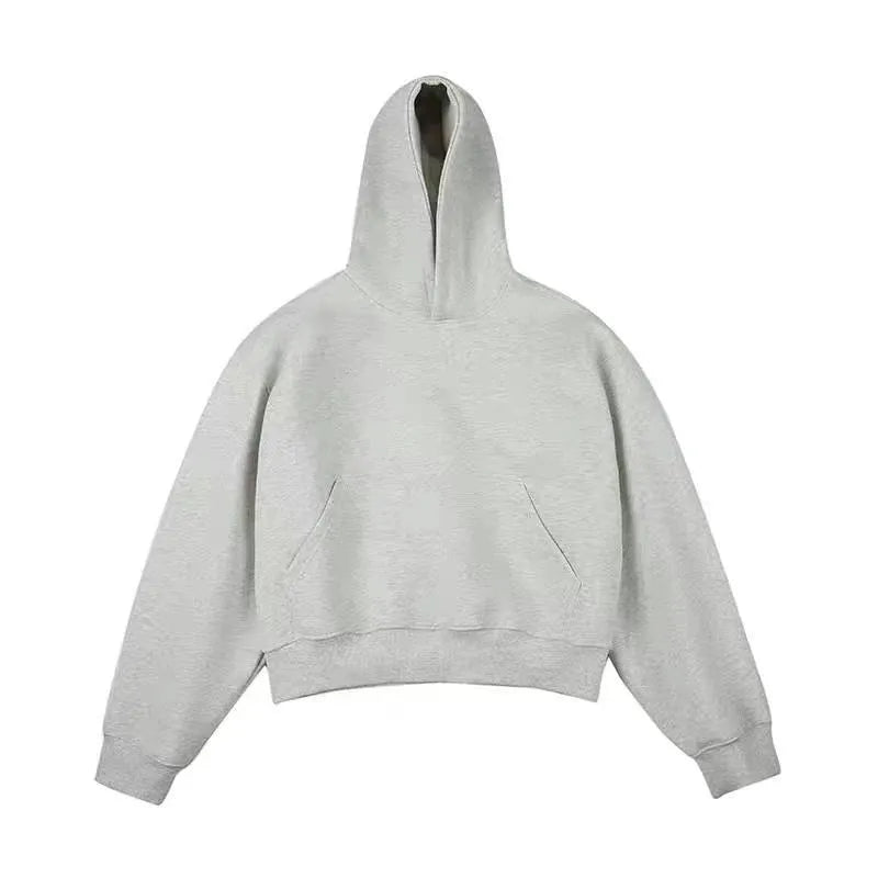 Short dark grey Chinese cotton composite hooded sweater with removable hood and long sleeves on a hanger.