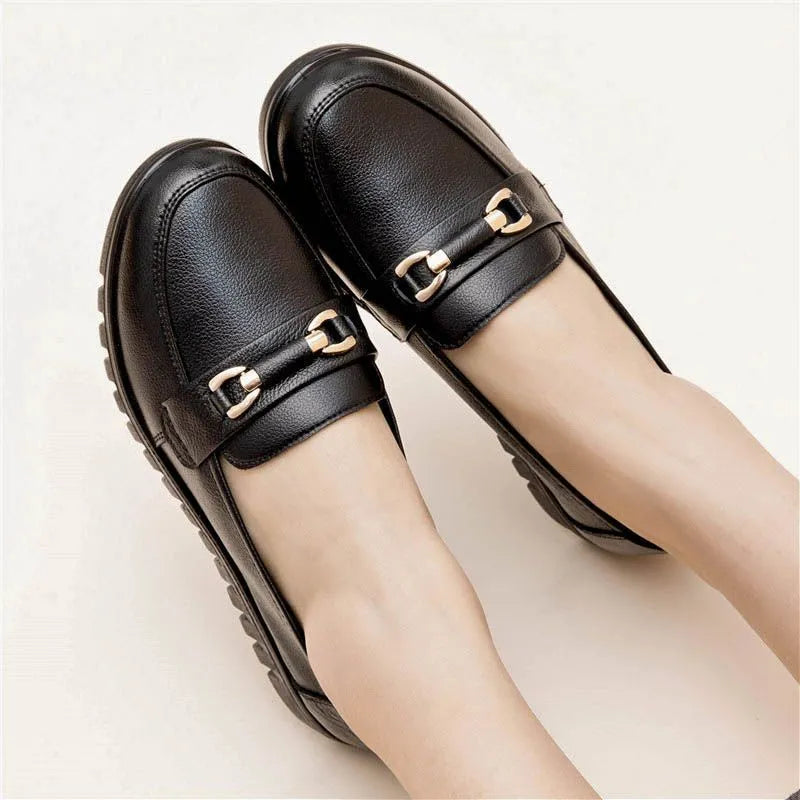 Black casual pumps with soft rubber sole and microfibre upper, shown on a plain background.