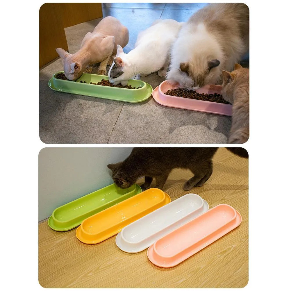 Set of four coloured plastic pet bowls with non-slip rubber bases for cats and dogs.