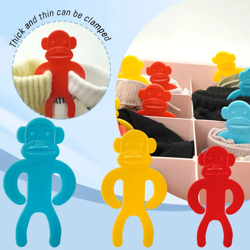 Plastic sock clips in blue, red and yellow for machine wash organisation