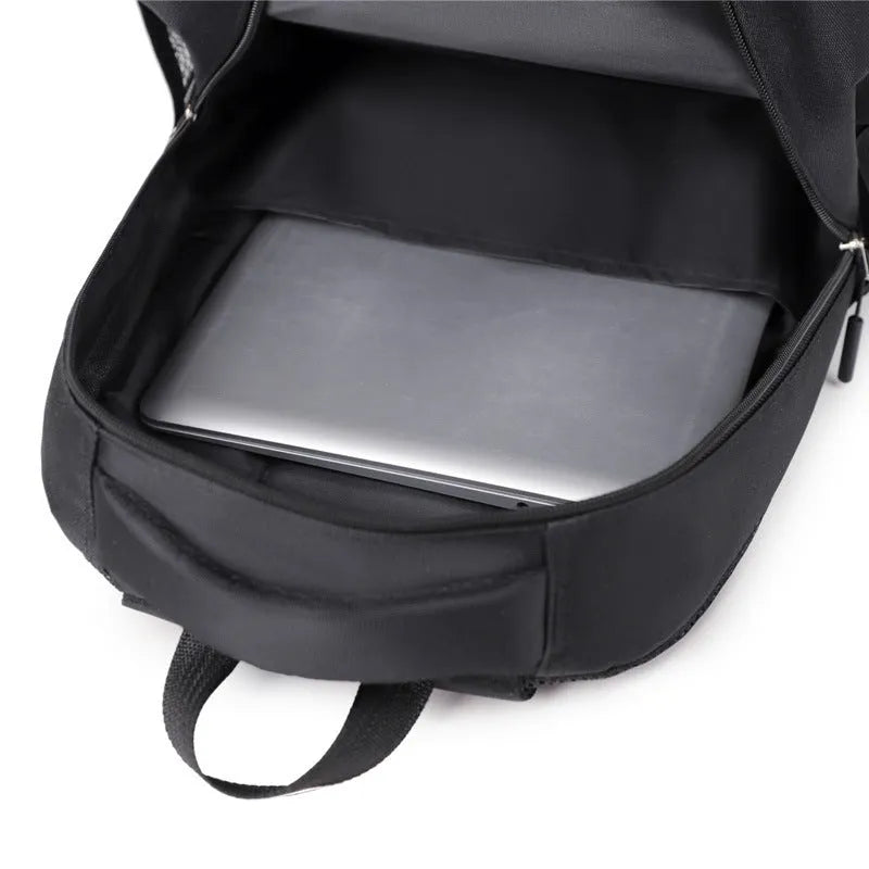 Casual men's Oxford cloth backpack in black, shown with a breathable back panel and polyester lining.