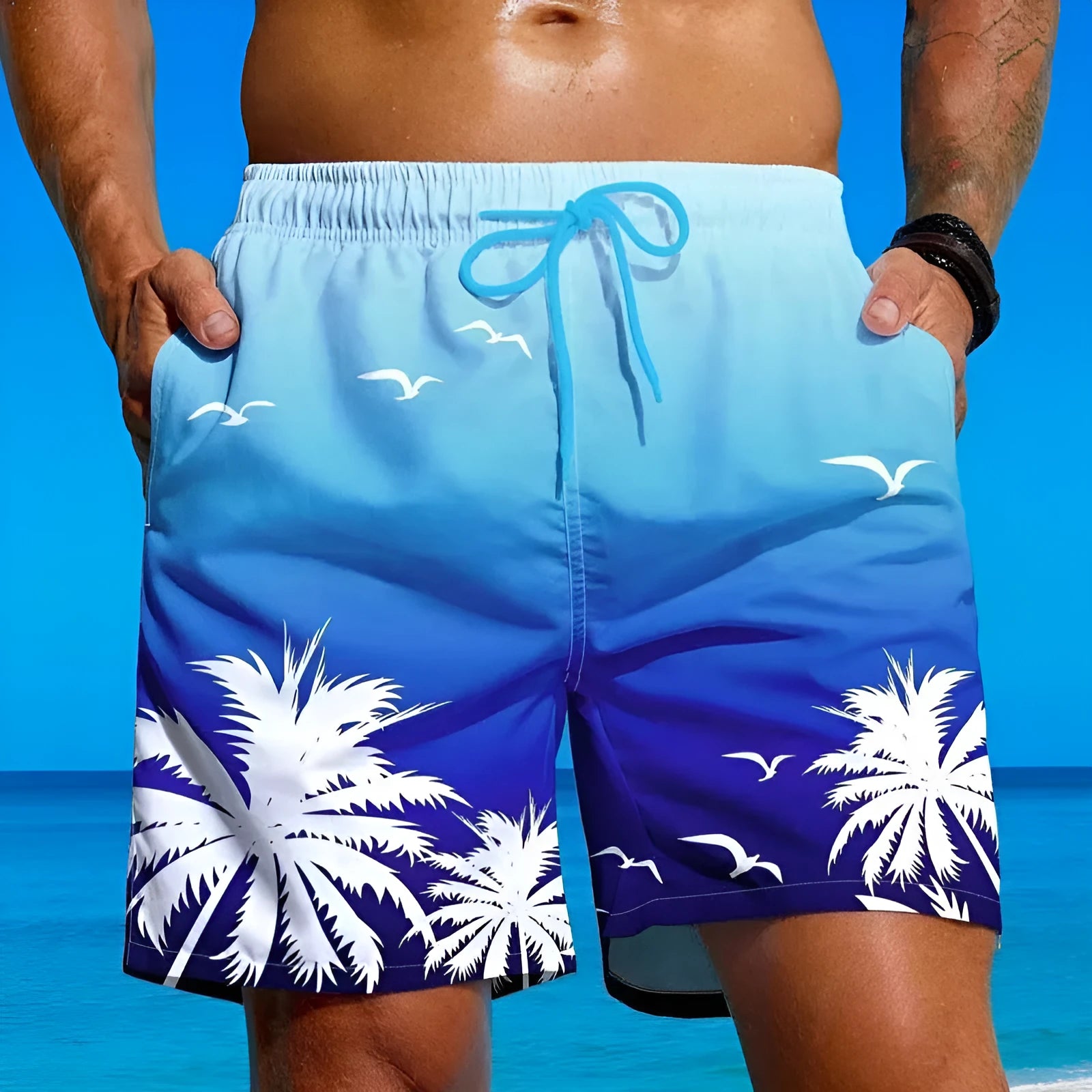 Men's loose board swimming trunks in polyester fibre, shown in an ethnic style design with an elastic waistband.