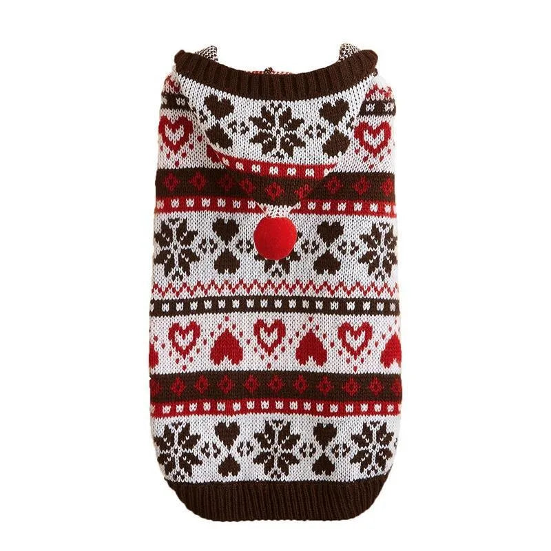 Pink knitted dog sweater with snowflake, love heart and stripe camouflage pattern on a small dog.