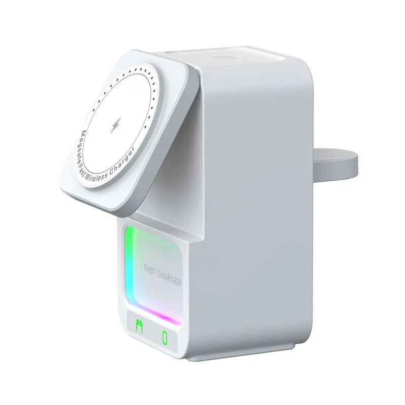 White and black 5-in-1 Bluetooth speaker wireless charger unit on a table