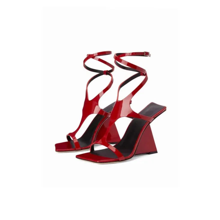 Women's black square-toe high heel sandals with a button fastening on a 9.5cm heel.