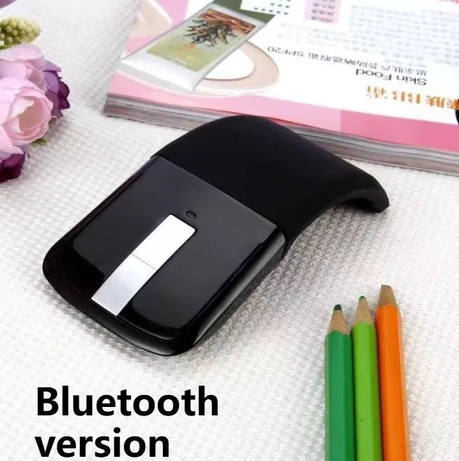 Black folding Bluetooth wireless mouse showing touch scroll area and compact folded size