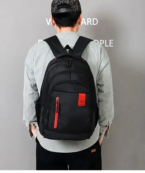 Oxford fabric teen backpack in multiple colours with reinforced shoulder straps and side zipper pockets