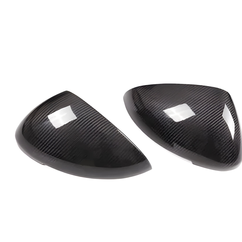 Pair of true carbon fibre rearview mirror covers for Porsche Macan, showing black woven texture.