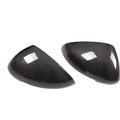 Pair of true carbon fibre rearview mirror covers for Porsche Macan, showing black woven texture.