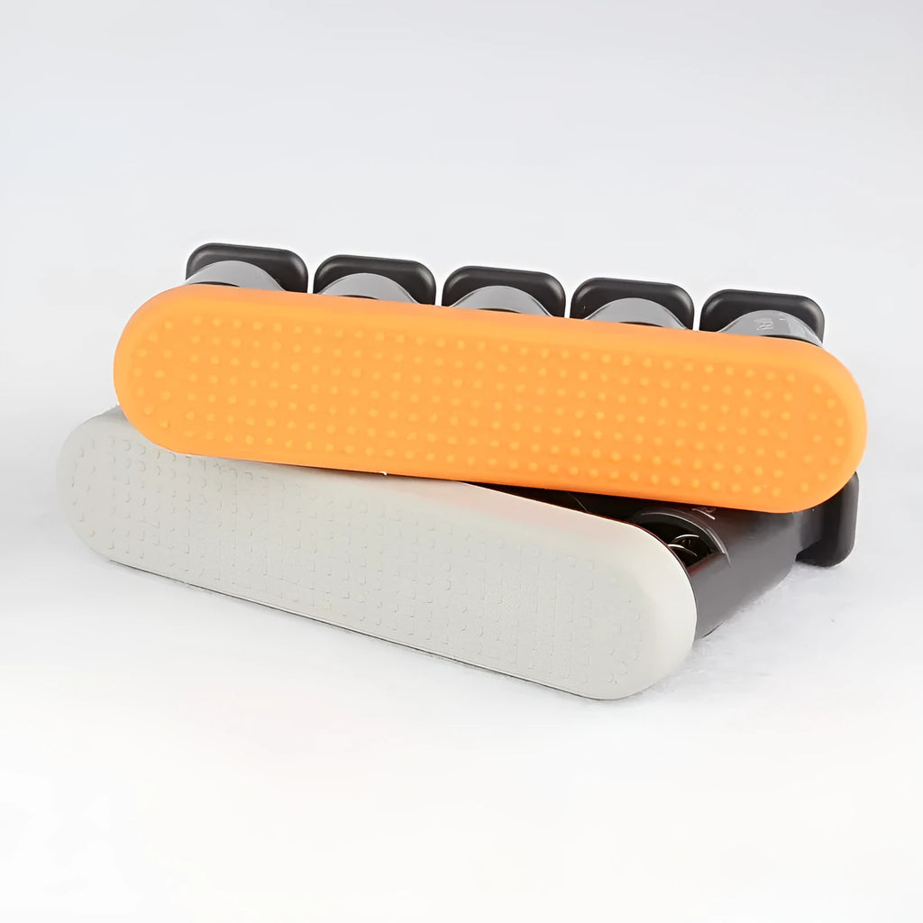 Gray and orange non-slip silicone finger trainer for hand muscle development.