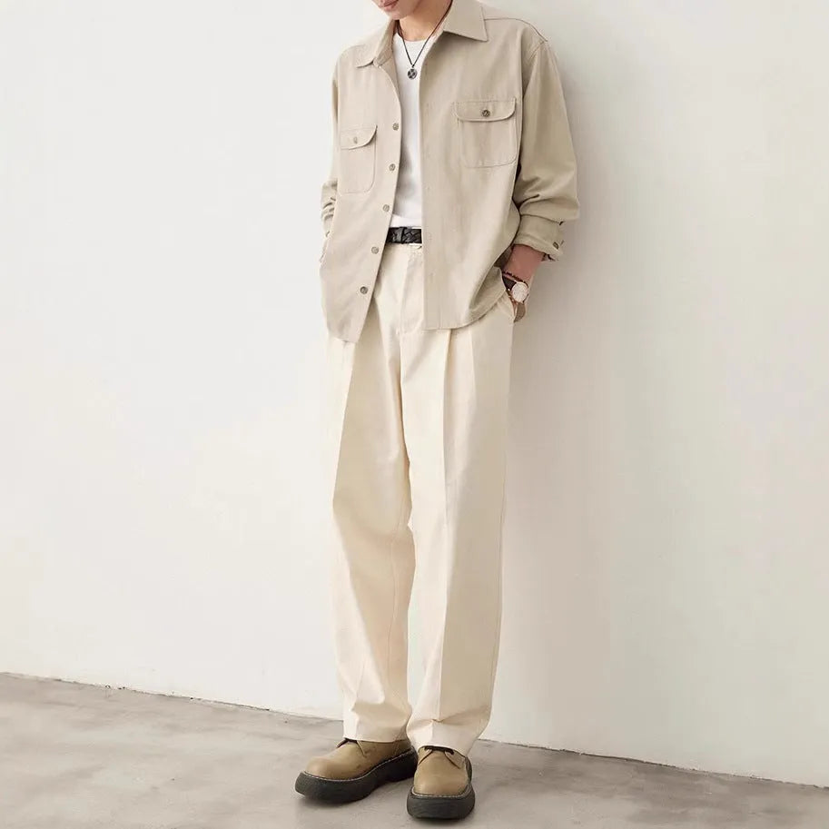 Men's light sand rice coloured long sleeve shirt with a lapel collar, laid flat.
