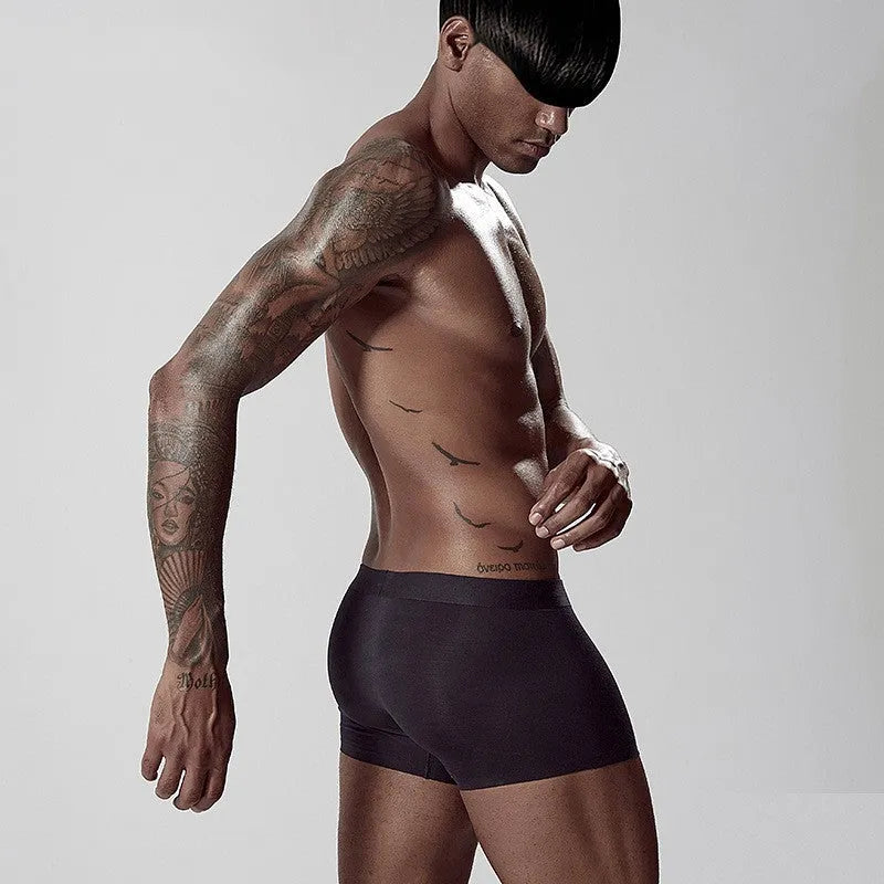 One-piece seamless modal men's underwear in a solid colour with a mid waist design.