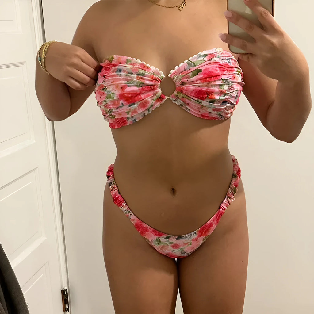 Women's floral print polyester bikini set in blue on a mannequin, showing tube top and briefs.