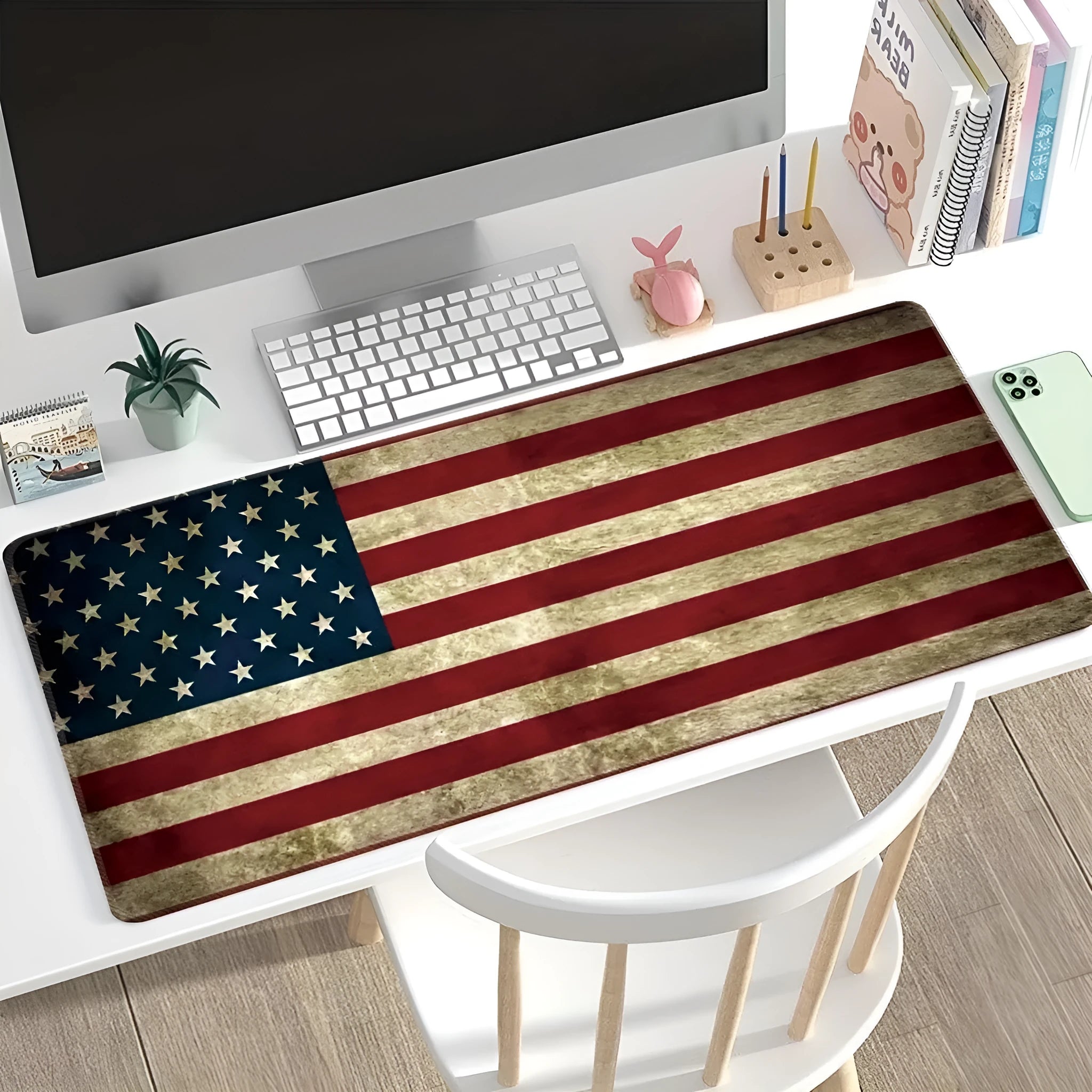 Large rectangular desk mat with printed pattern on a wooden desk, featuring a keyboard and mouse.