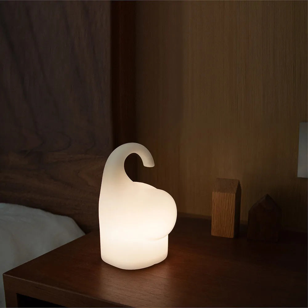 DOMI Elephant silicone night light with soft white LED glow on bedside table