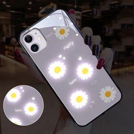 iPhone case with TPU protective shell showing daisy painted design and voice-activated colour light feature