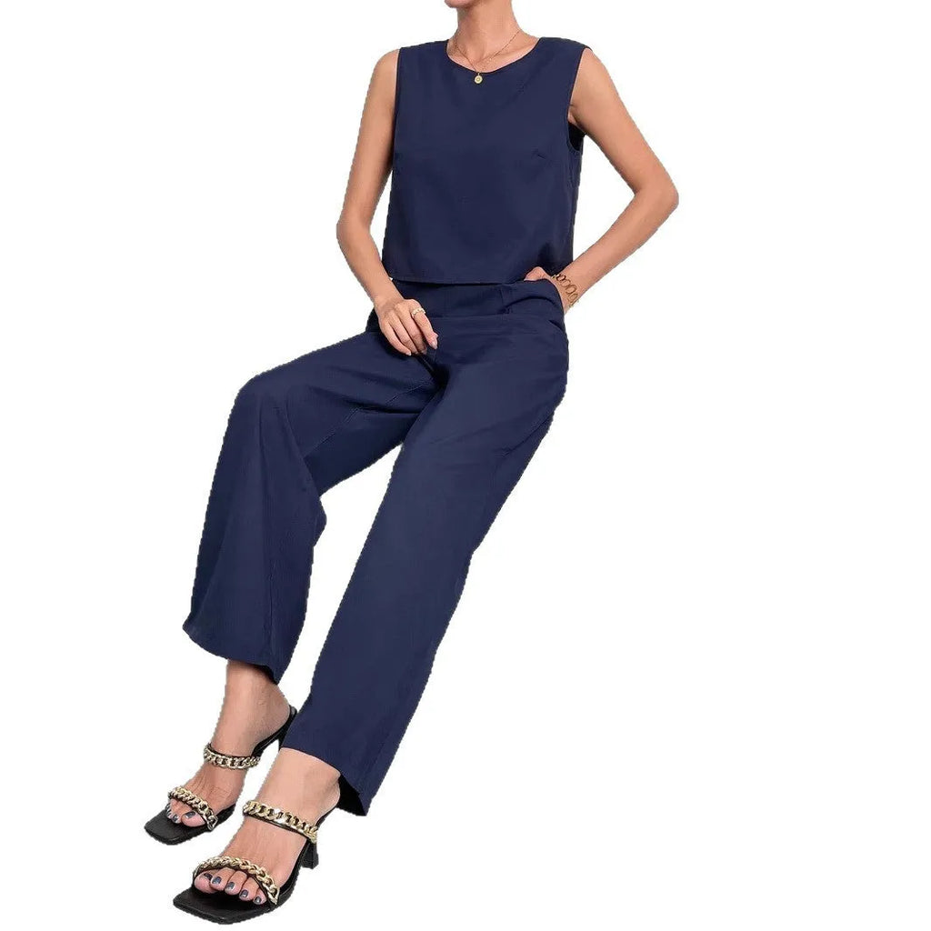 Women's red polyester two-piece set with sleeveless round neck top and wide leg trousers displayed together