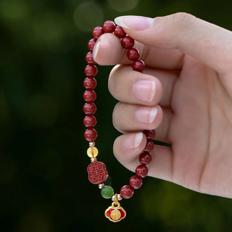 Happy Eyebrow Bracelet with fu character bead on raw emperor sandstone cinnabar beads.