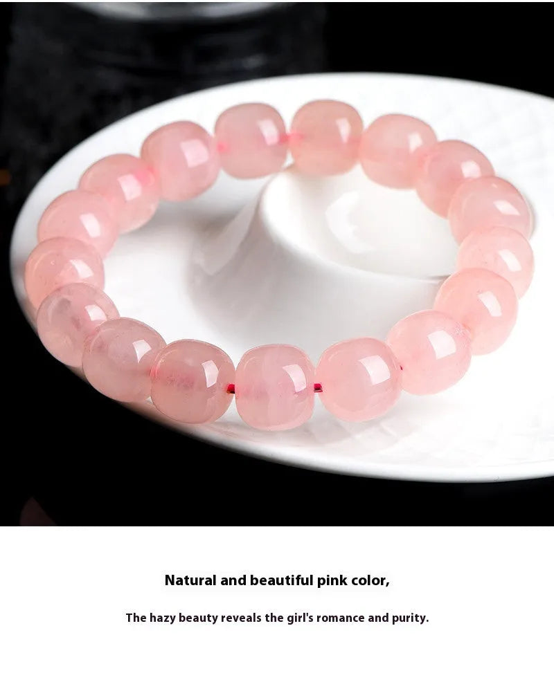 Pink crystal barrel bead bracelet with geometric 8x10mm beads on wrist