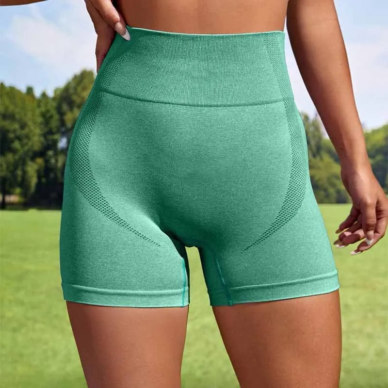 Women's high waist seamless sport shorts in solid colour made of nylon spandex blend for yoga and gym
