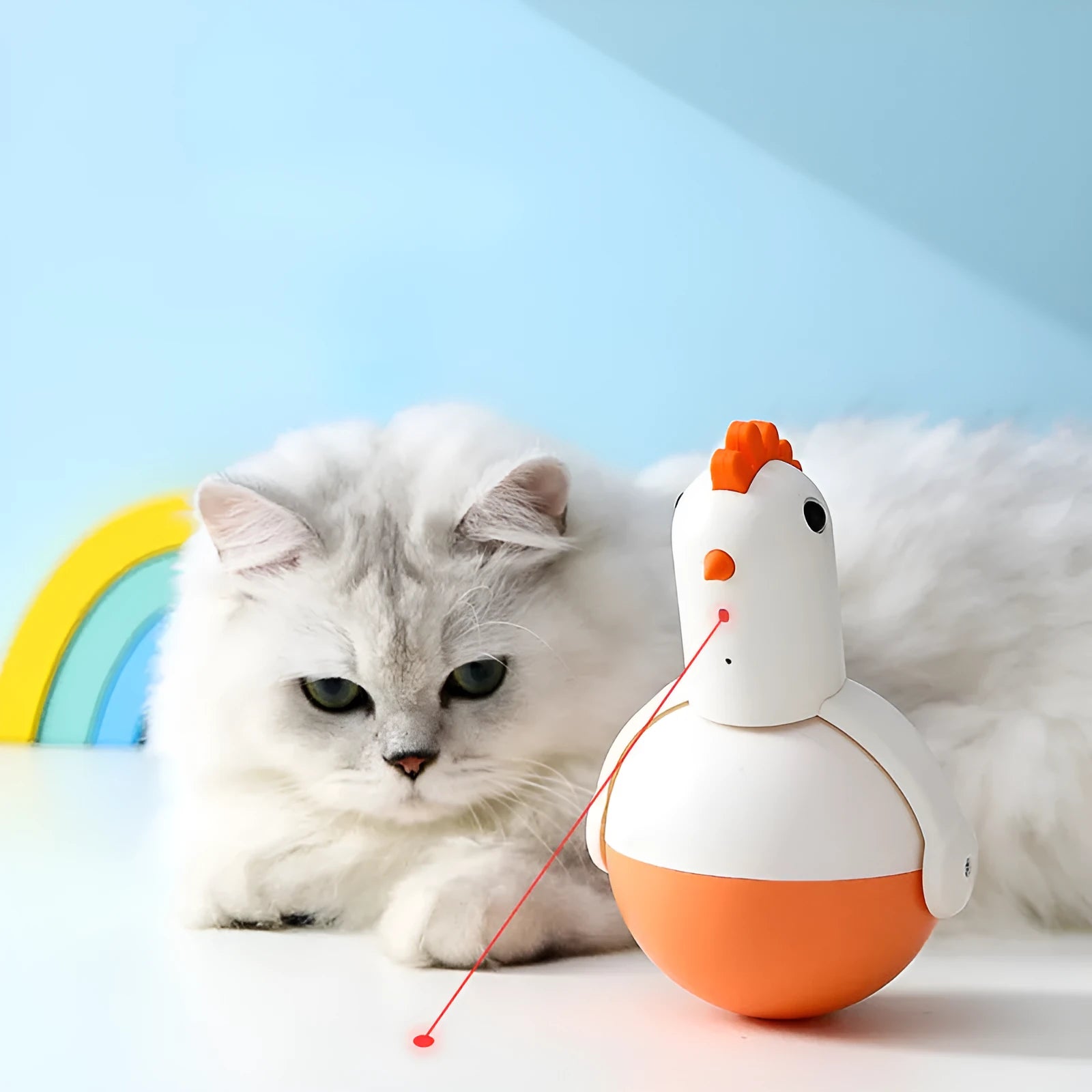 Green and orange electric cat toy chicken shape with laser light and motion features on a floor.