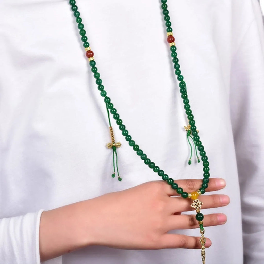Handmade multi-circle bracelet with green agate beads from Brazil, shown in unisex styling.