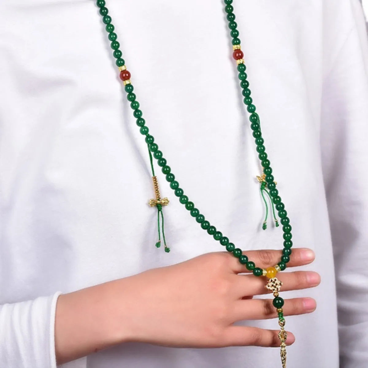 Handmade multi-circle bracelet with green agate beads from Brazil, shown in unisex styling.