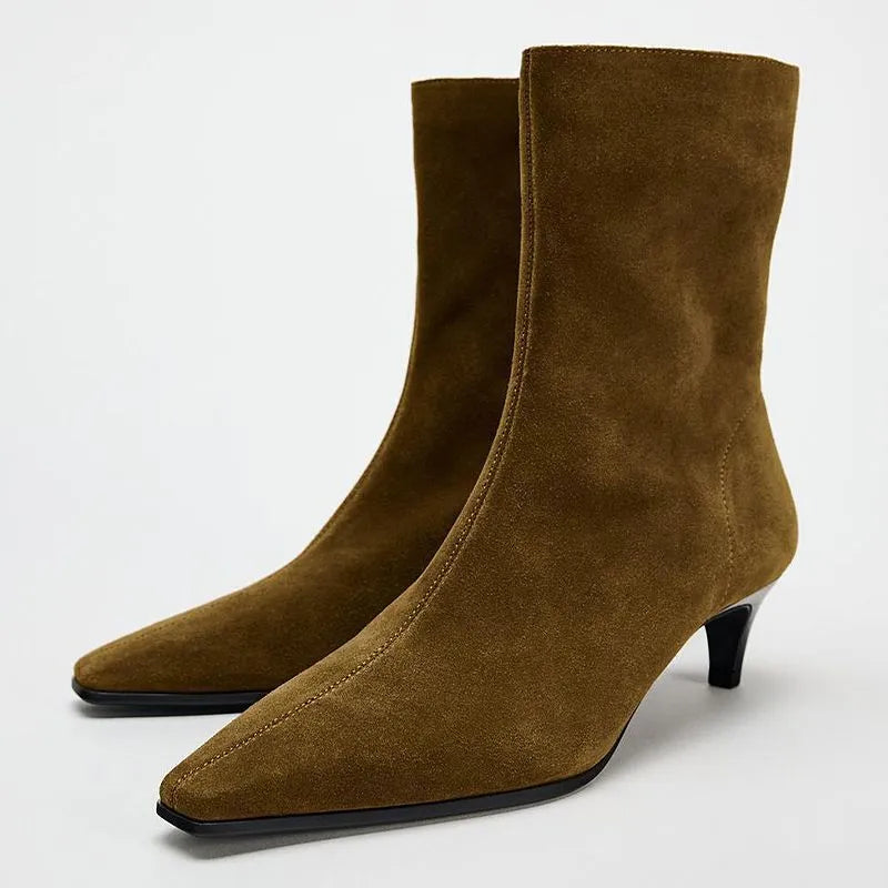 Brown square toe ankle boots with side zip and a mid stiletto heel on a waterproof platform sole.