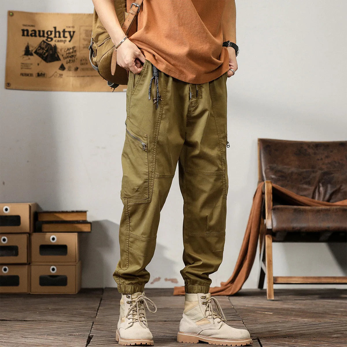 Men's tapered harem pants in cotton fabric showing ankle banded design and small leg opening