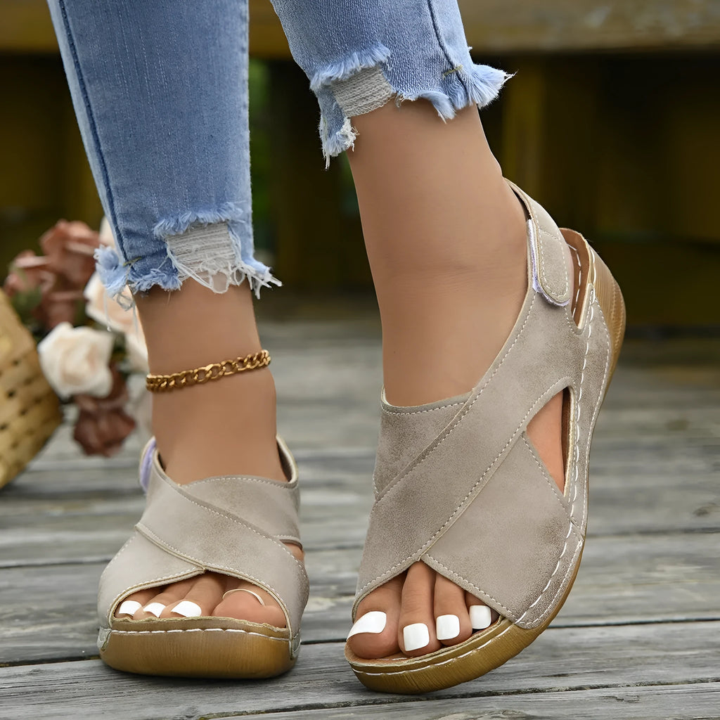Roman platform sandals with skirt detail showing adjustable Velcro strap and open toe design