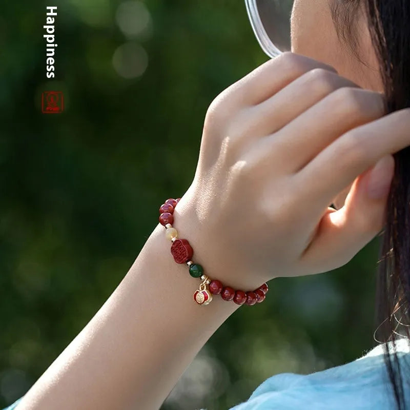Happy Eyebrow Bracelet with fu character bead on raw emperor sandstone cinnabar beads.