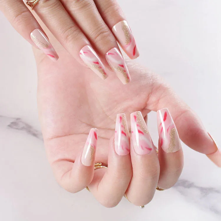 Wearable manicure set with 24 medium nails in rose, tulip, leopard print, and XINGX designs, plus glue.