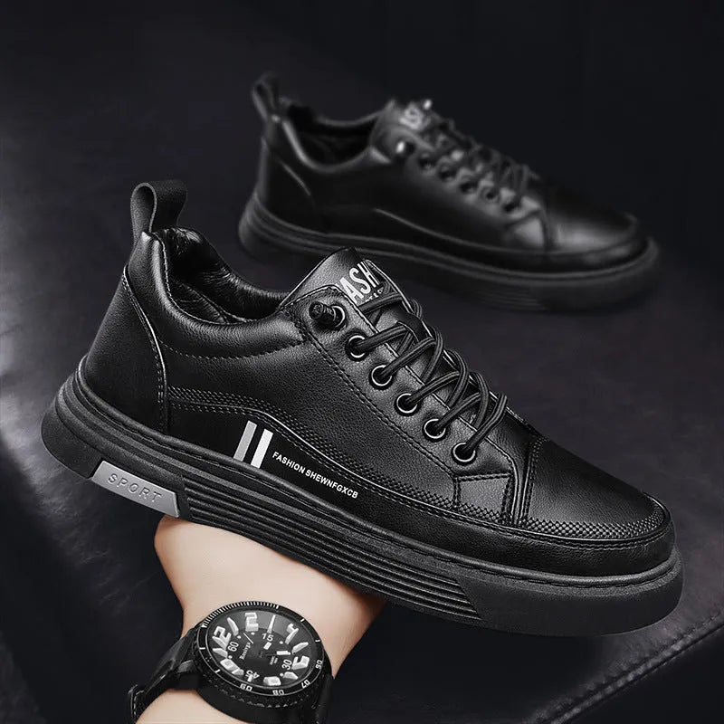 Men's black and white low-top skate shoes with elastic band fastening and rubber sole.
