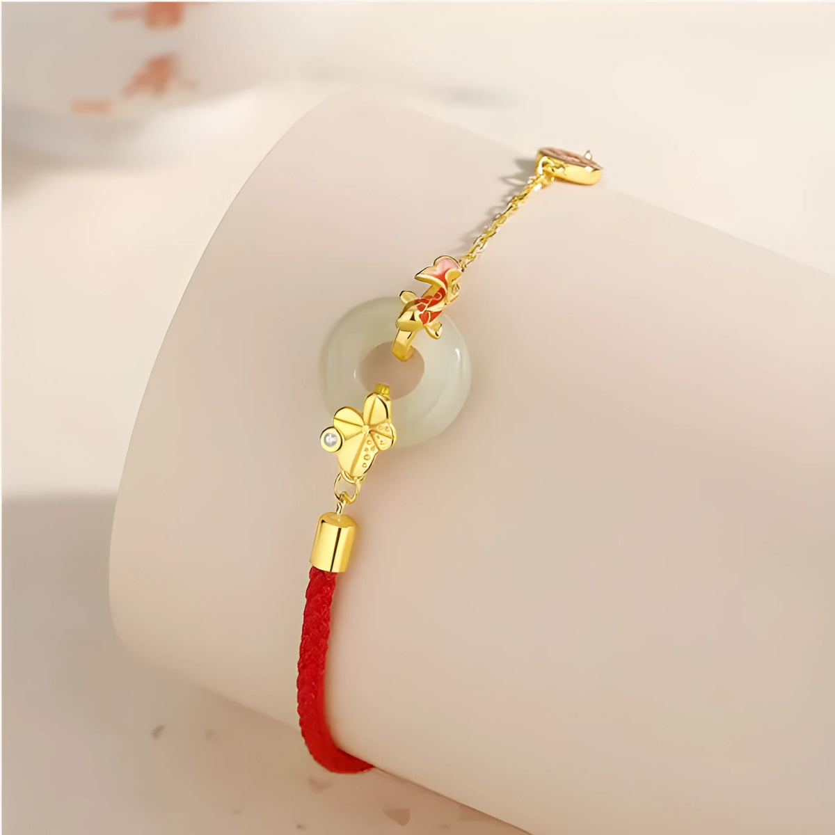 Gold electroplated Koi Peace Buckle Hetian Jade Red Rope Bracelet with safety clasp and animal zodiac design
