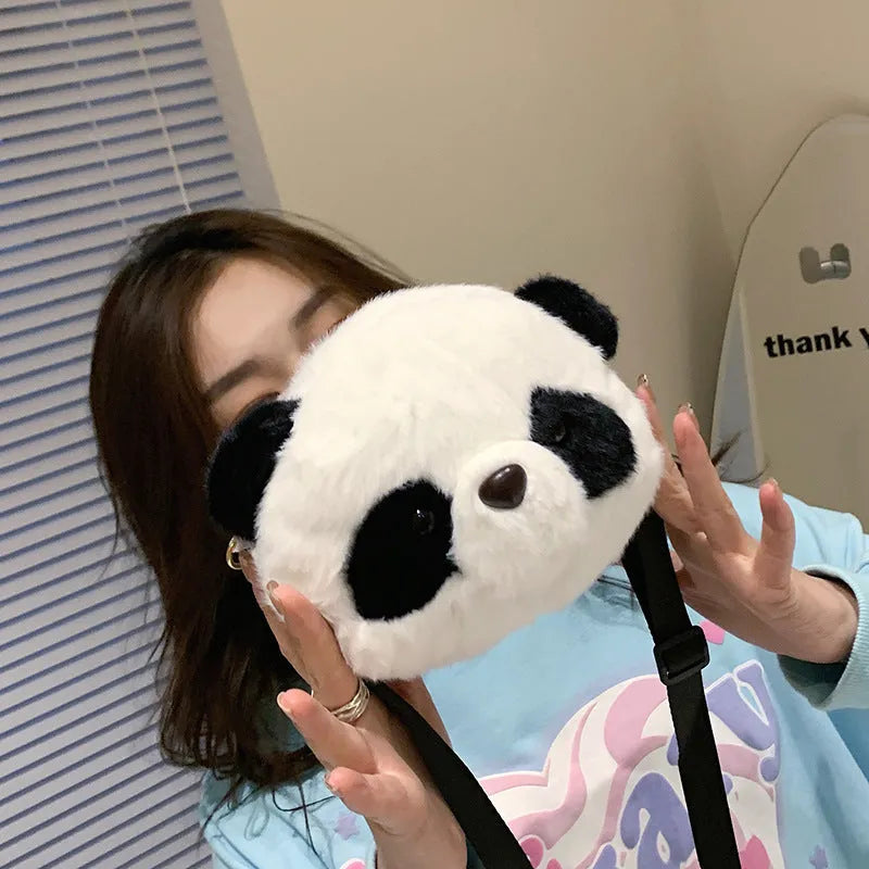 Plush cylindrical crossbody bag with panda head design measuring 18cm by 15cm by 8cm
