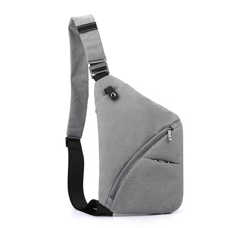 Black Oxford cloth men's chest bag with one shoulder strap and urban letter detail.