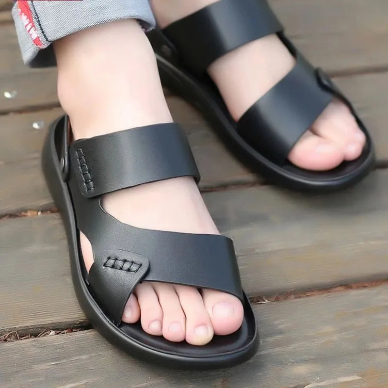 Men's brown waterproof plastic slip-on sandals on a grey background.
