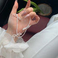 White geometric bow pearl necklace for women with adjustable 31-40cm length