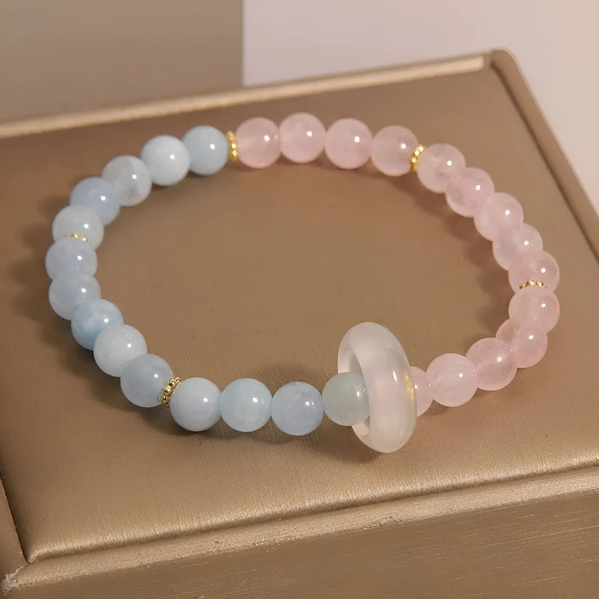 Aquamarine crystal women's bracelet with mixed materials and geometric round elements