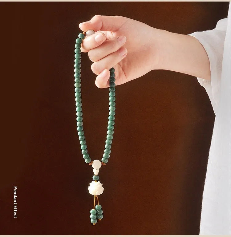 White jade Bodhi green sandalwood bracelet with beaded design and double ring safety buckle clasp.