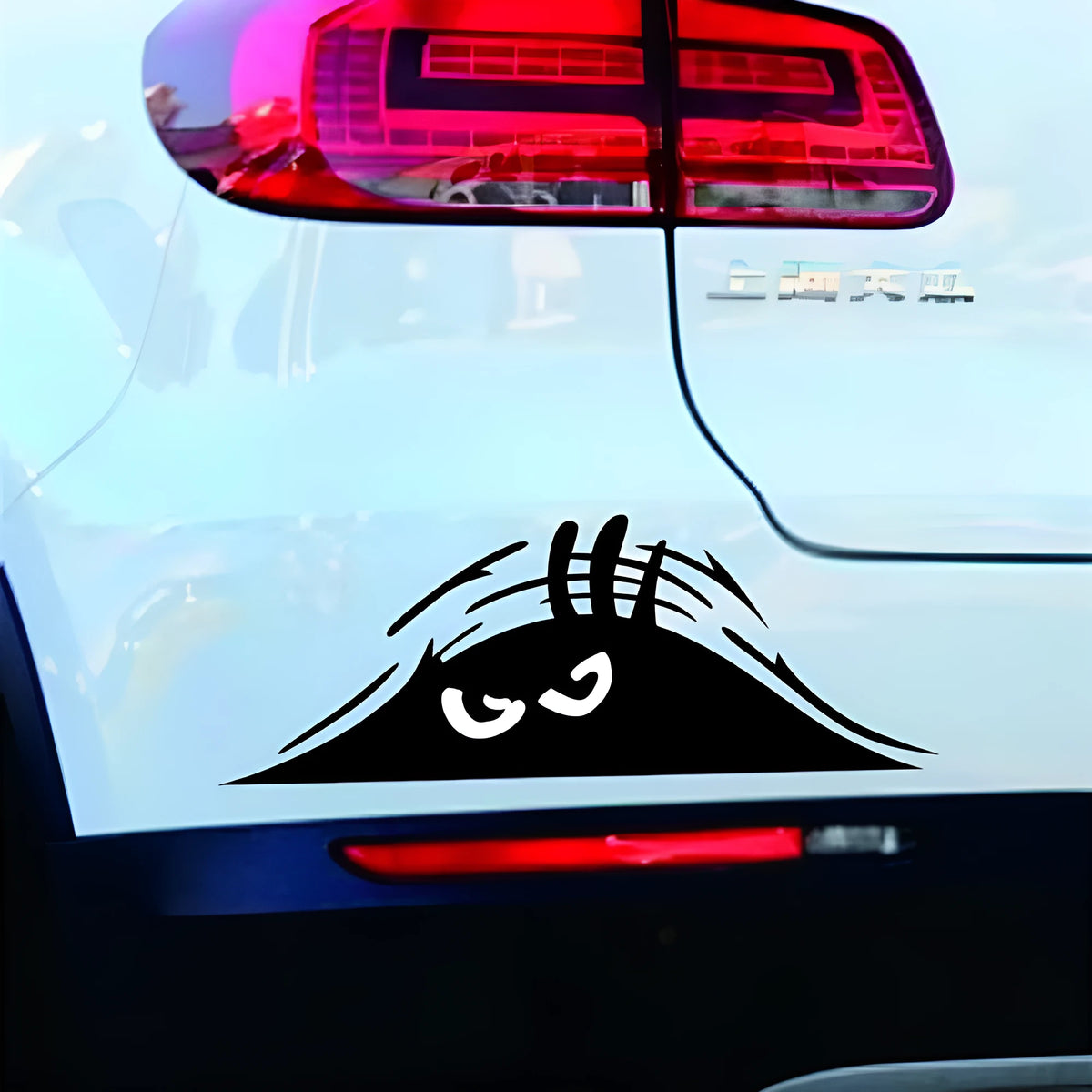 Self-adhesive body stickers showing smiley and angry face designs measuring 19cm by 7cm