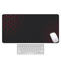 Large rectangular desk mat with printed pattern on a wooden desk, featuring a keyboard and mouse.