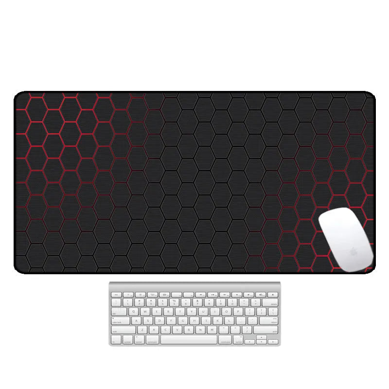 Large rectangular desk mat with printed pattern on a wooden desk, featuring a keyboard and mouse.